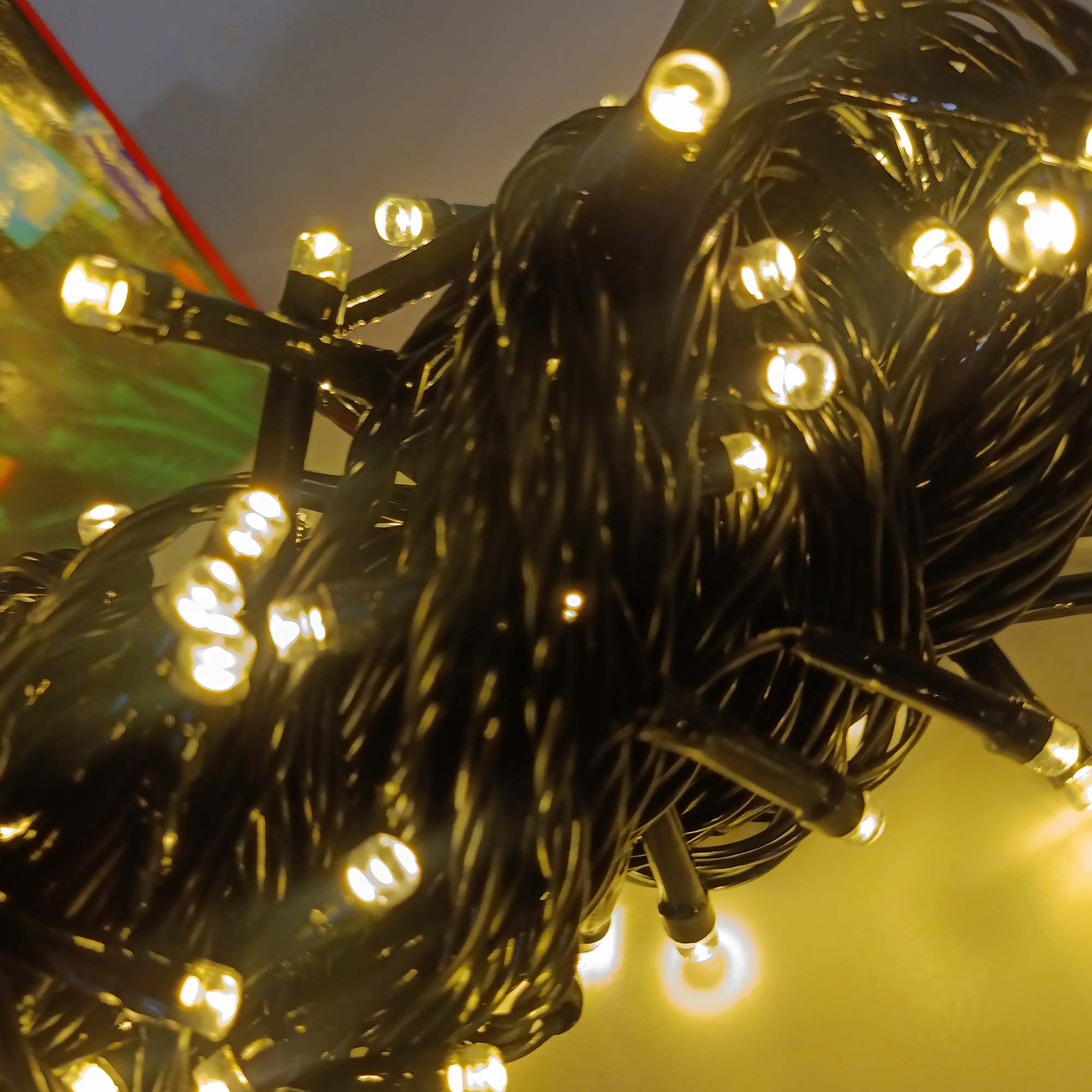 Гирлянда "Нить" 10м, темная нить, свечение желтое теплое РД18270